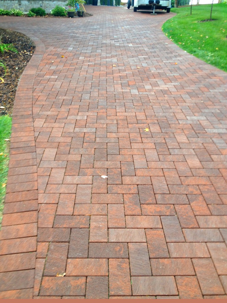 bricked pathway leading to garage