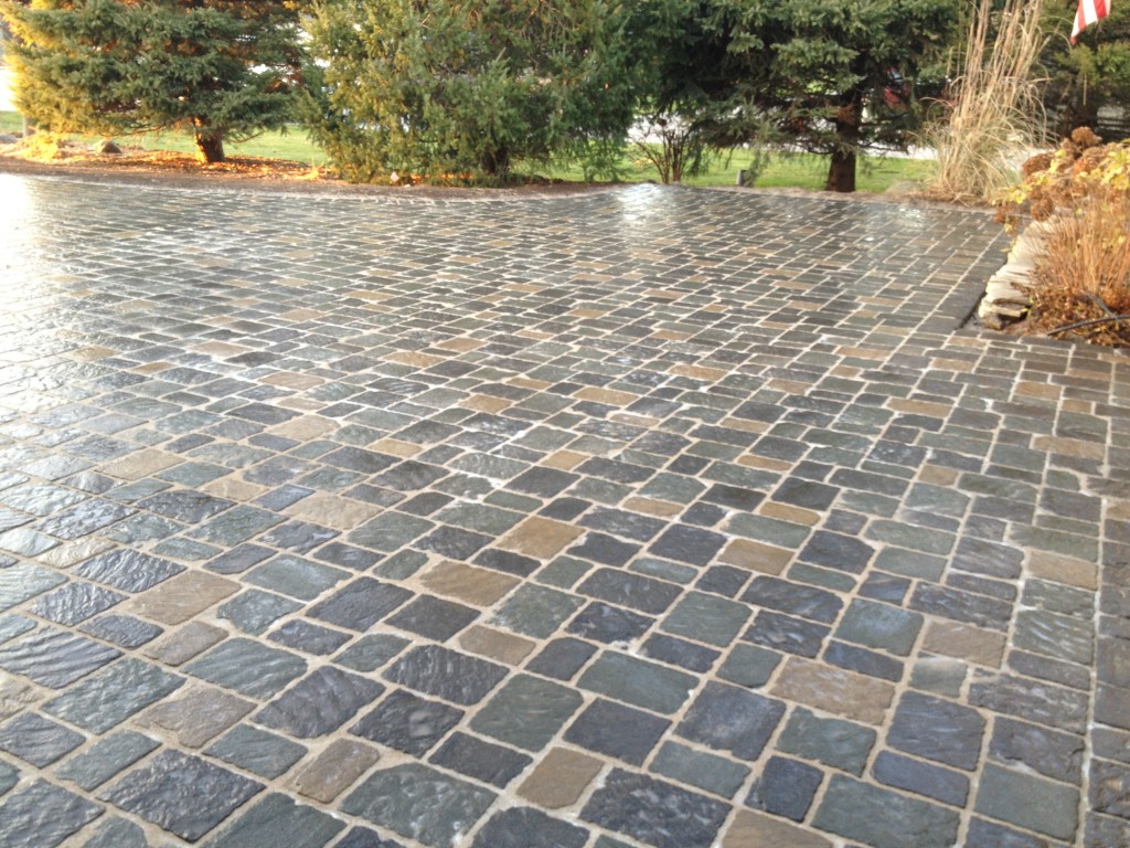 multi color smooth pavers outside of residential home