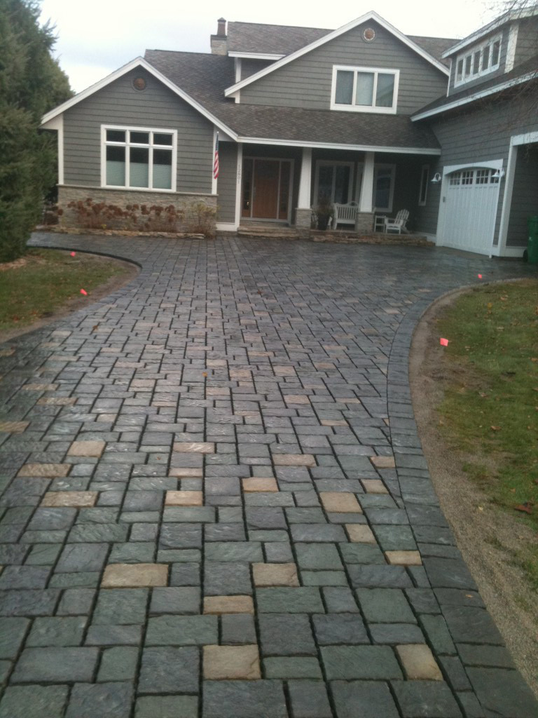 smooth square paver driveway to front of home