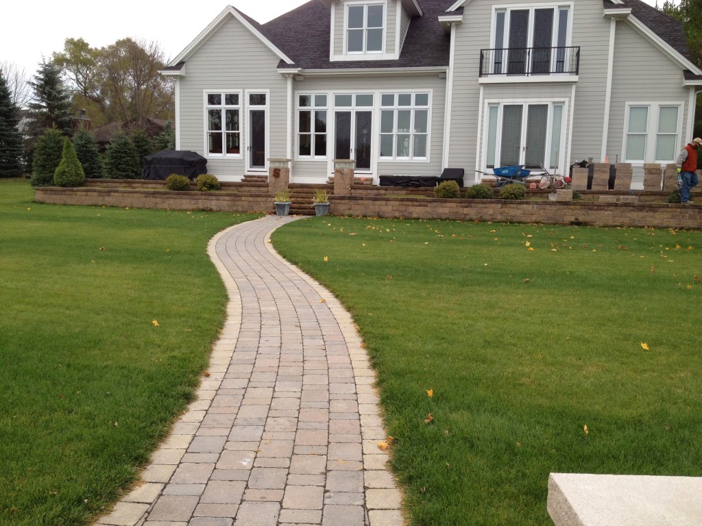 brick pathway to back entrance of home
