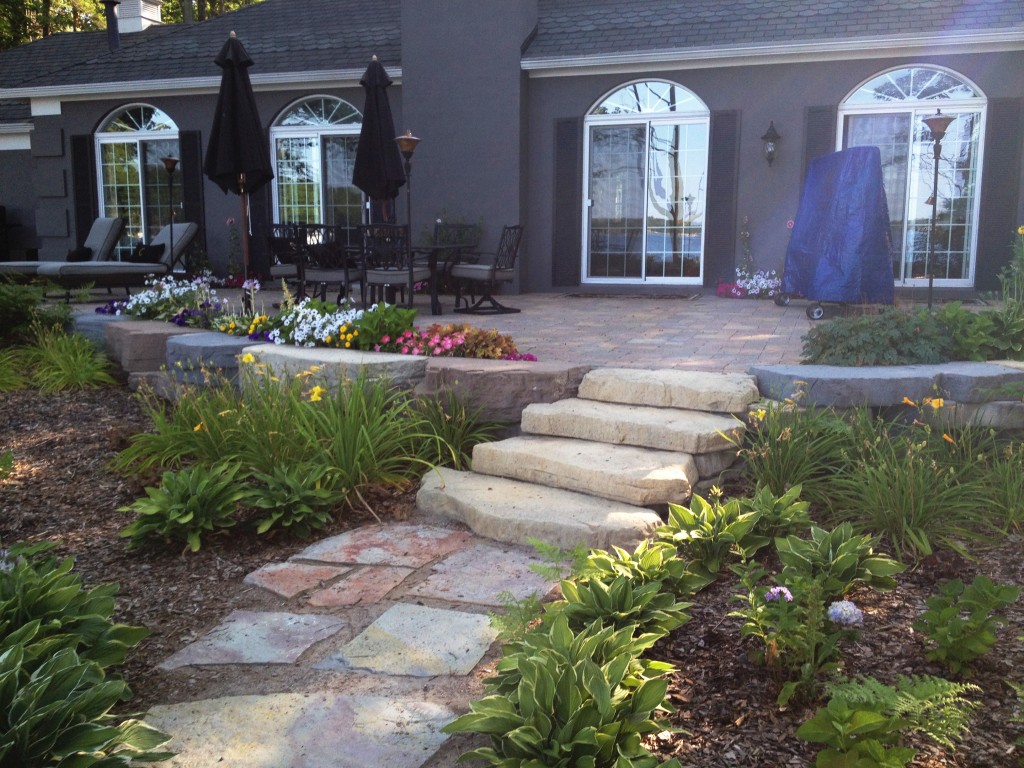 large flat stone walkway to patio stairs
