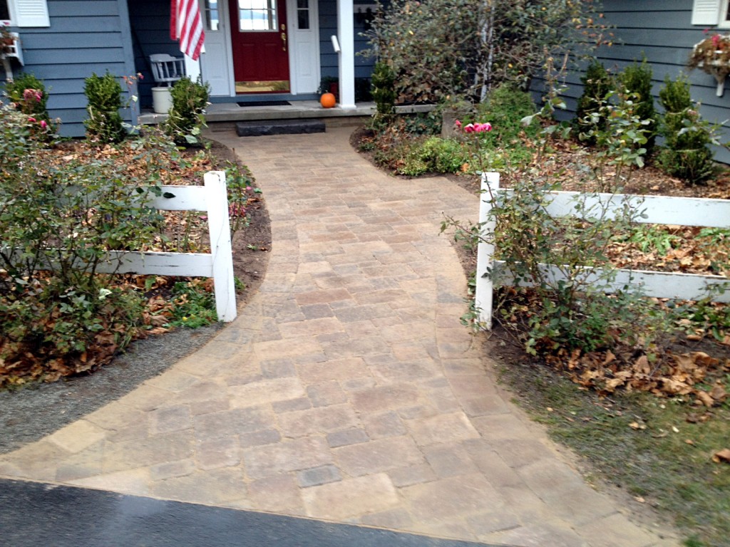 pathway to front door with white fence accents