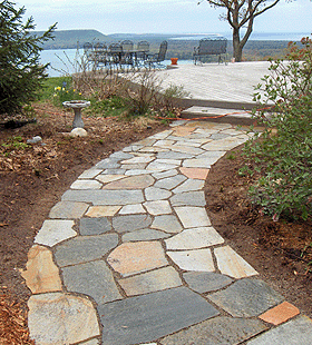 multi colored stone pathway leading to overlook of the bay