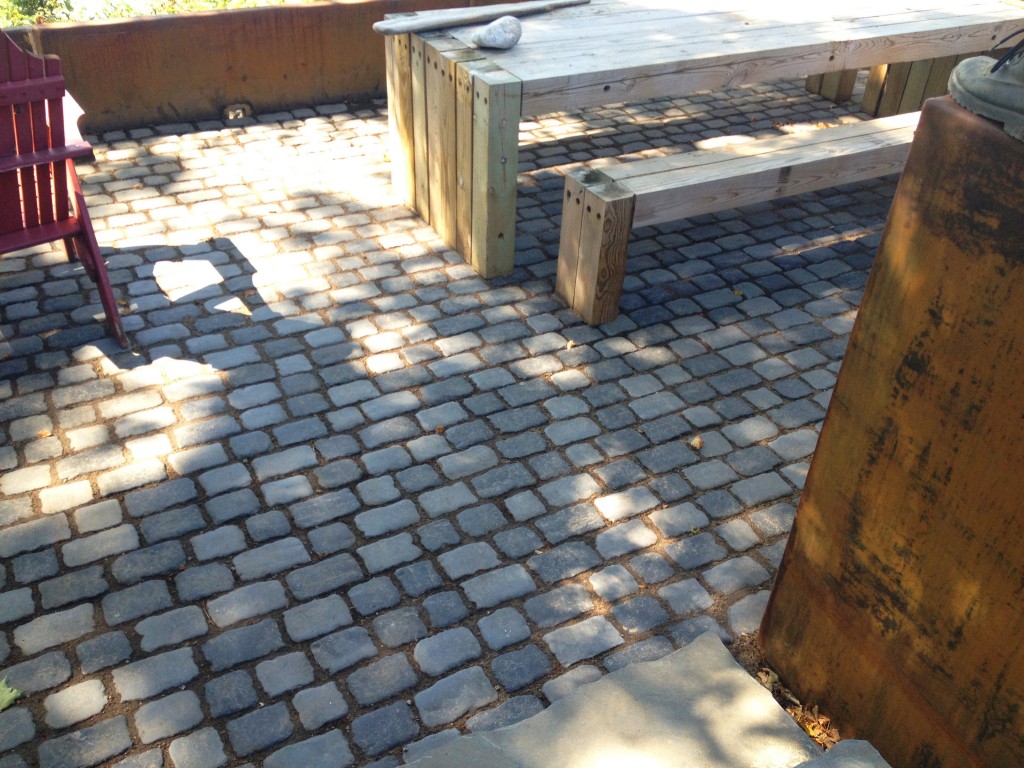 darkly colored paving stones used in outdoor space