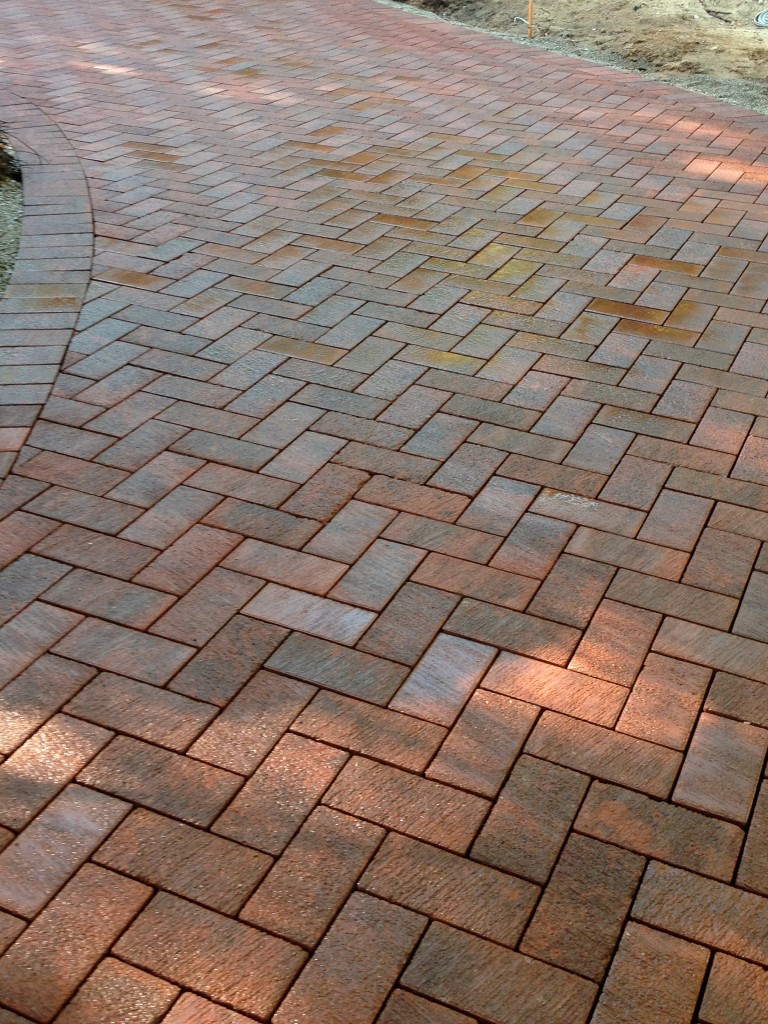 dark terra cotta bricks in a chevron pattern 