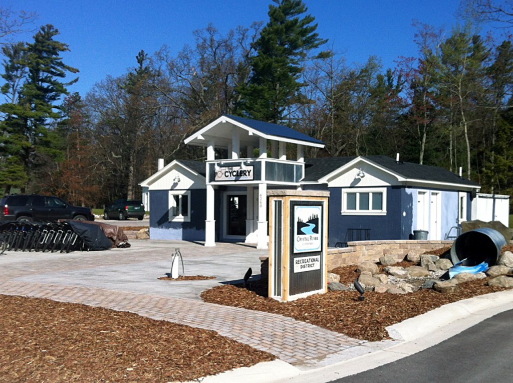 business front with large mulch areas and bicycle rack