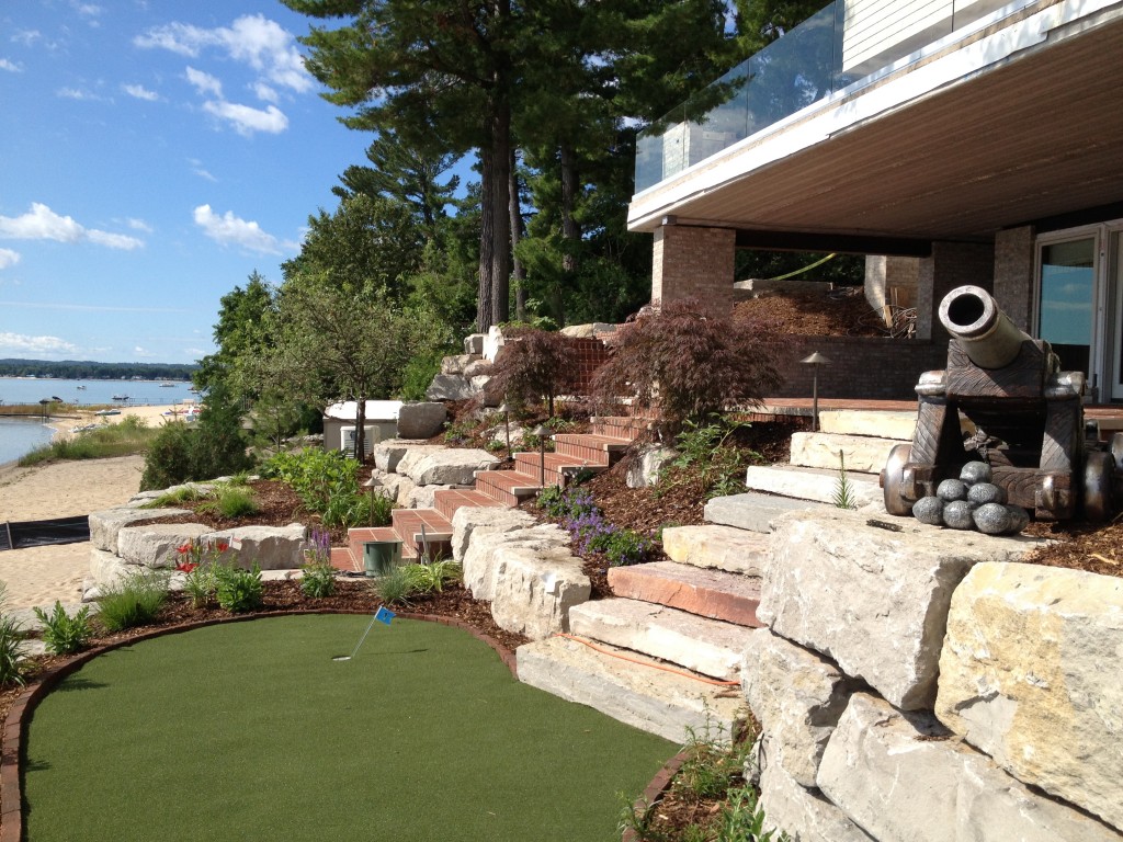 cannon statue atop stone retaining wall