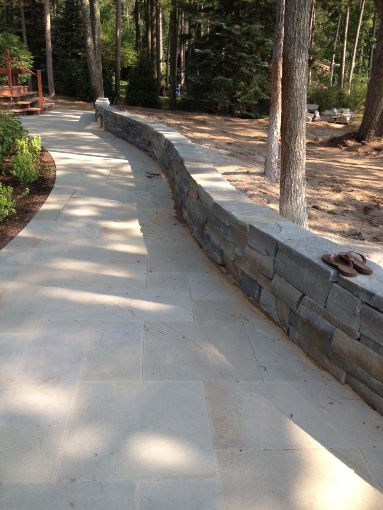 smooth sidewalk in wooded area