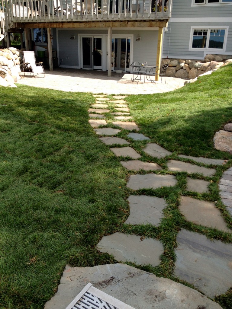 inlayed rock path leading to basement door