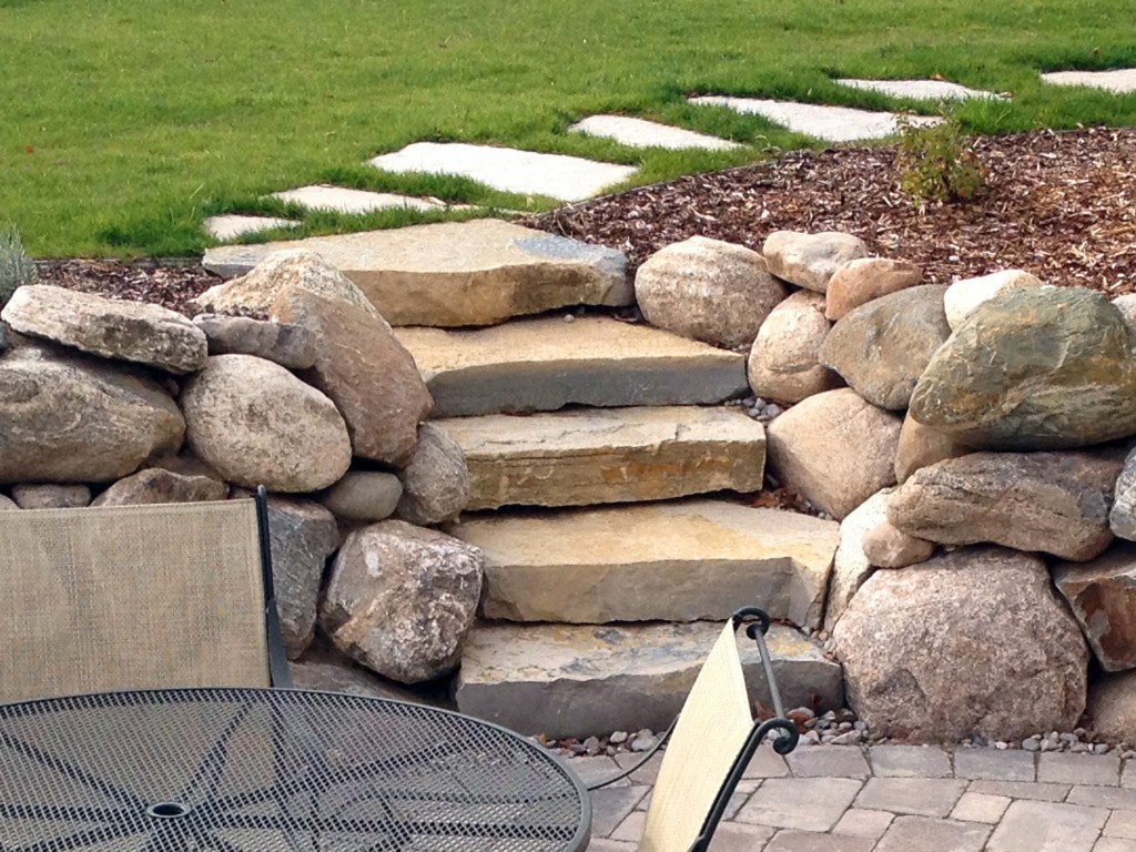 stone inlayed in lawn pathway