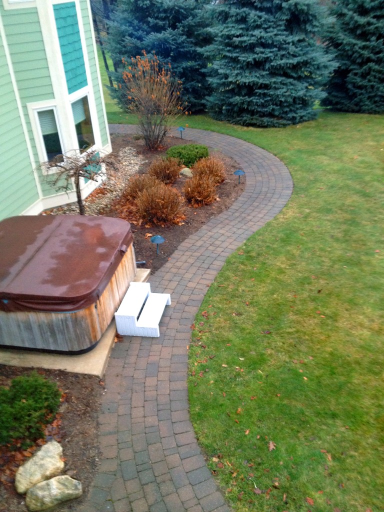 backyard brick pathway to hot tub