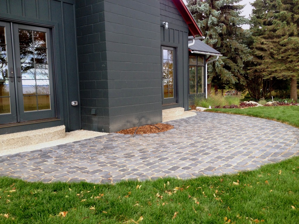 dark paving stones used in a semi circle pattern