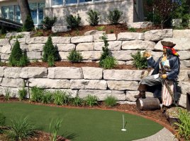 pirate statue alongside putting green