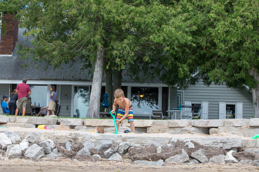 boy digging in sandbox