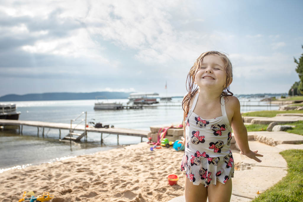 young child having fun at the beach