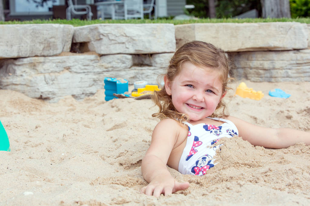 little girl playing at the beach