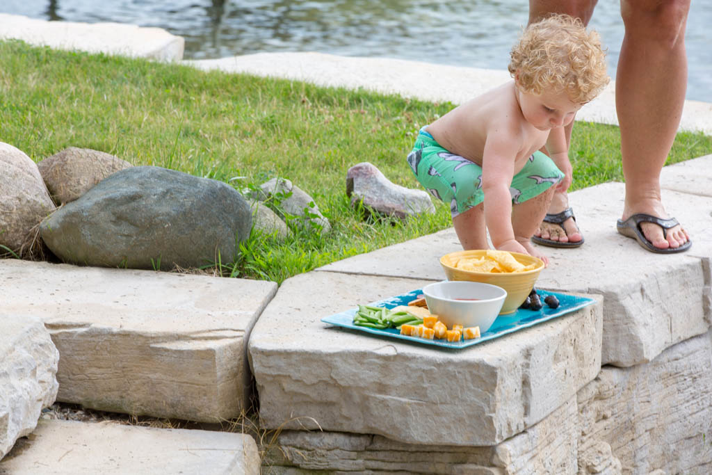 small boy eating a snack 