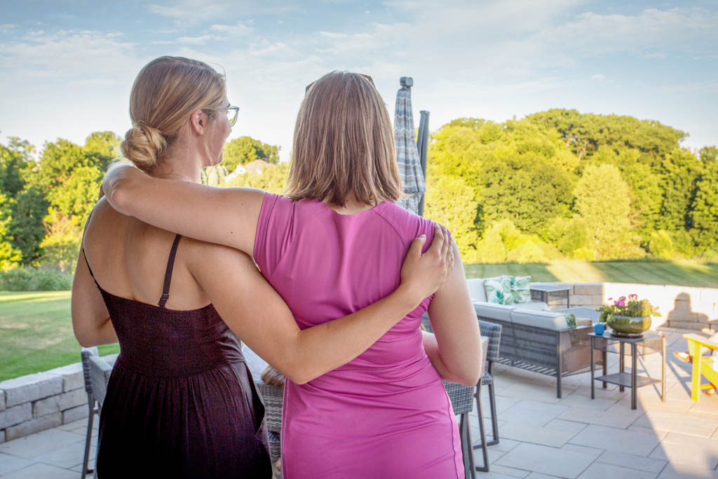 women bonding over beautiful landscape