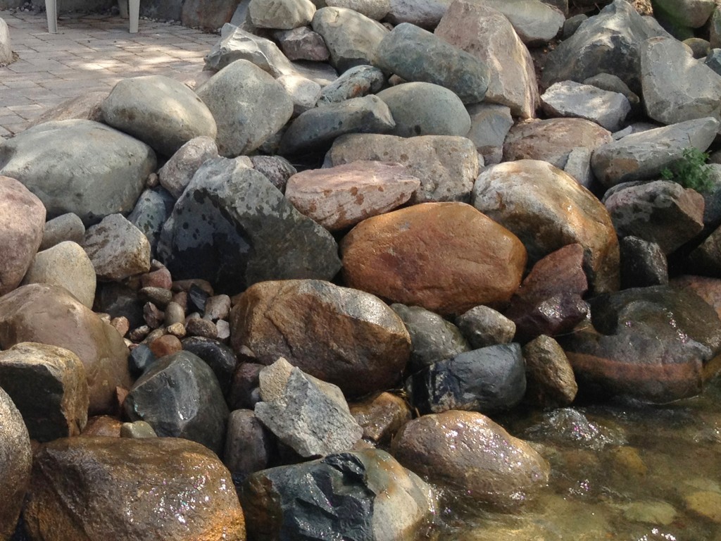 large natural rock barrier along the shoreline